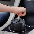 Compact lidded trash bin for storing small waste in a car