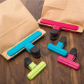 Three reusable small bag sealing clips in assorted colors